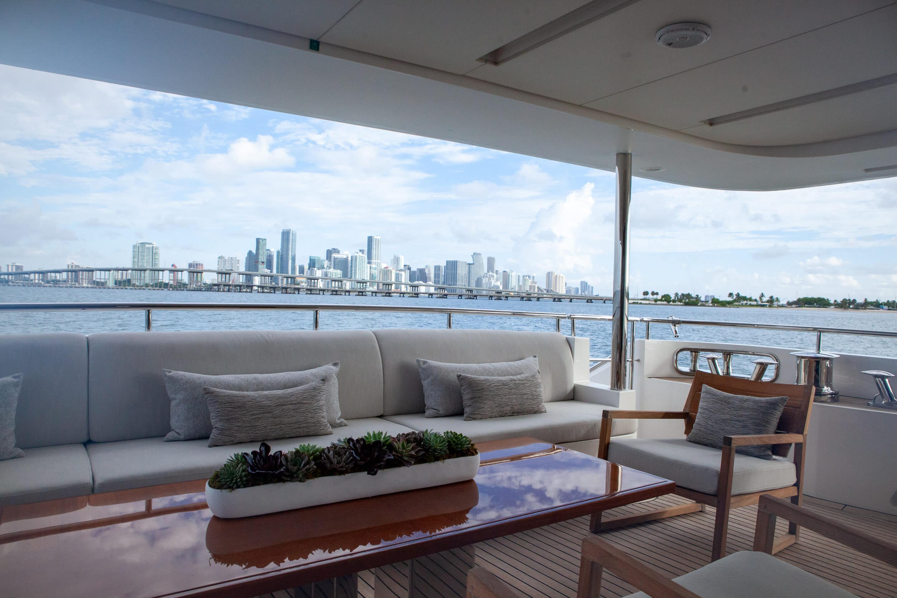 Closer angled look at looking out onto the Aft Deck with the Miami Beach City Skyline in the background.