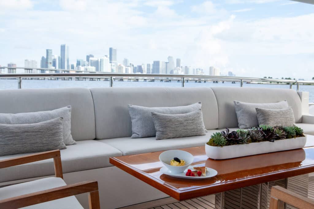 Caviar on table of Aft Deck with Miami City Skyline in the background.